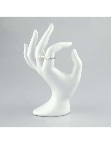 A sterling silver ring with an elongated plate featuring five 3/4 round white pearls RR5055S