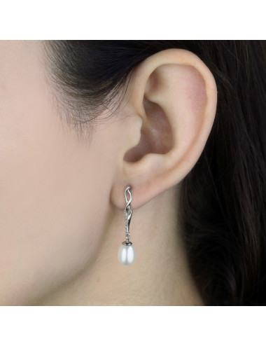 Silver post earrings with intersecting ribbons adorned with cubic zirconia, topped with an oval white pearl KSc7080Sm2